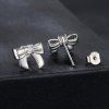 Royal Fashion stříbrné rhodiované náušnice Mašličky s drahokamem moissanitem